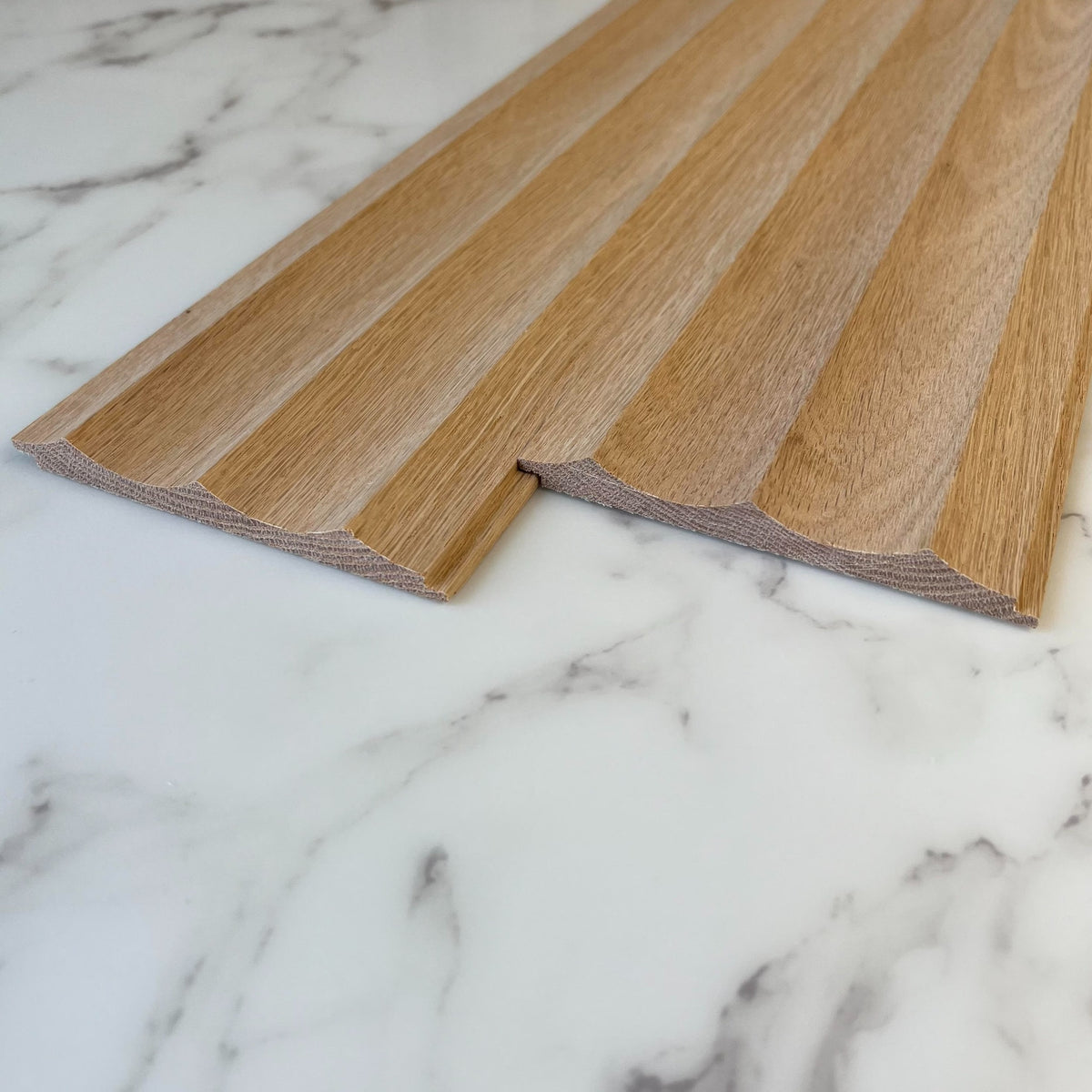 Timeline Fluted 1.5 Wide Scallop solid wood wall panel showing fluted tambour concave scallop paneling installed as acoustic slat wall in real hardwood