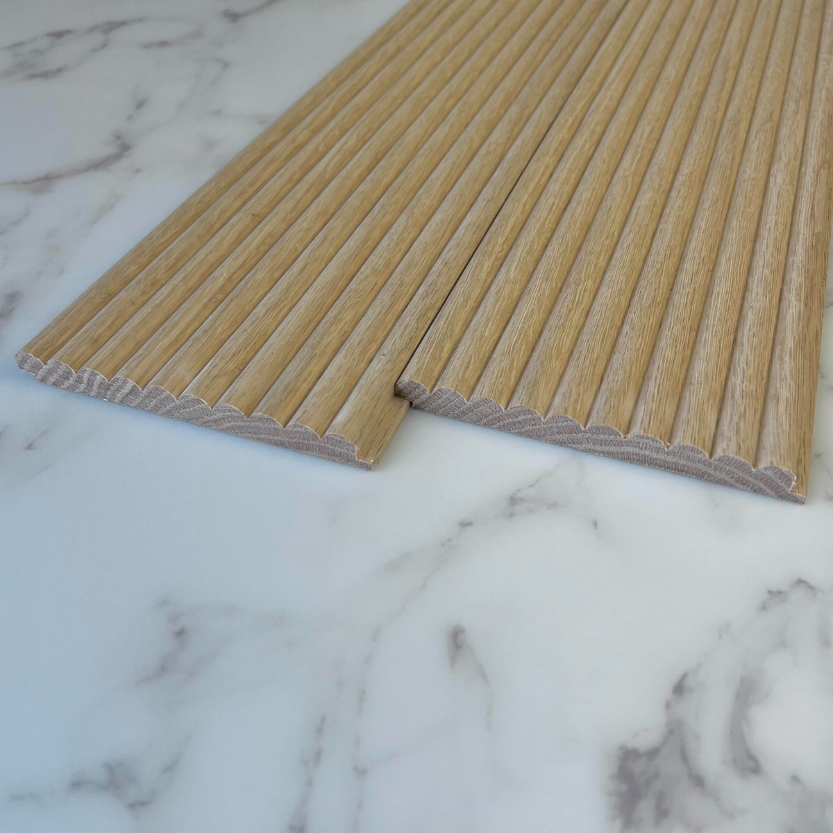 Timeline Fluted Half Inch Reeded solid wood wall panel showing reeded beaded half round profile installed as tambour slat wall acoustic paneling in real hardwood