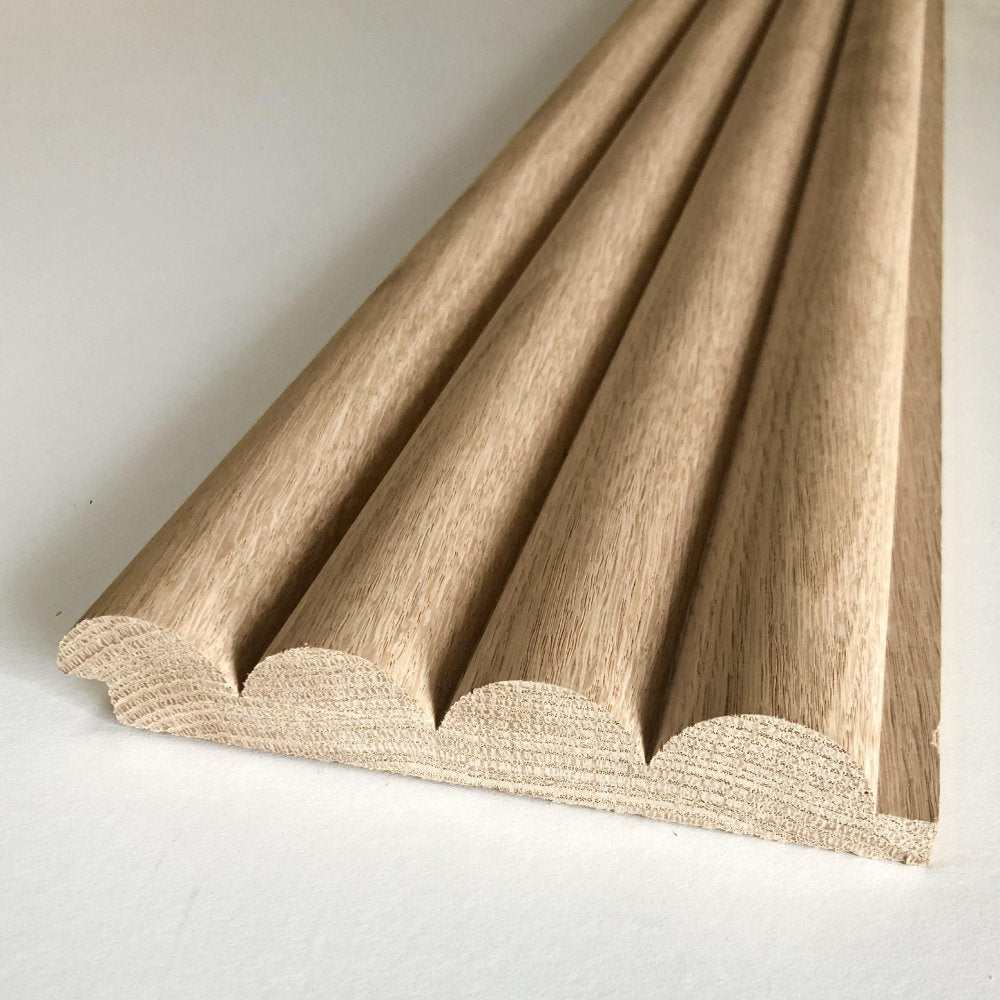 Timeline Fluted Round solid wood wall panel showing red oak beaded half round slat wall reeded acoustic wall profile close-up in real hardwood